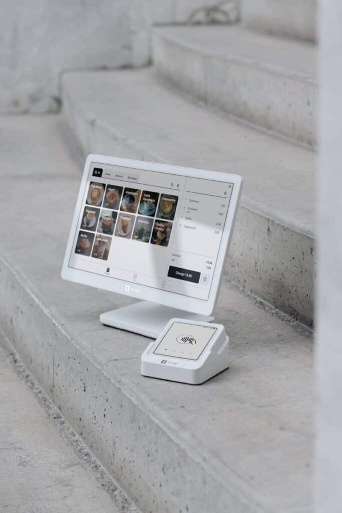 A computer monitor sitting on top of a set of stairs